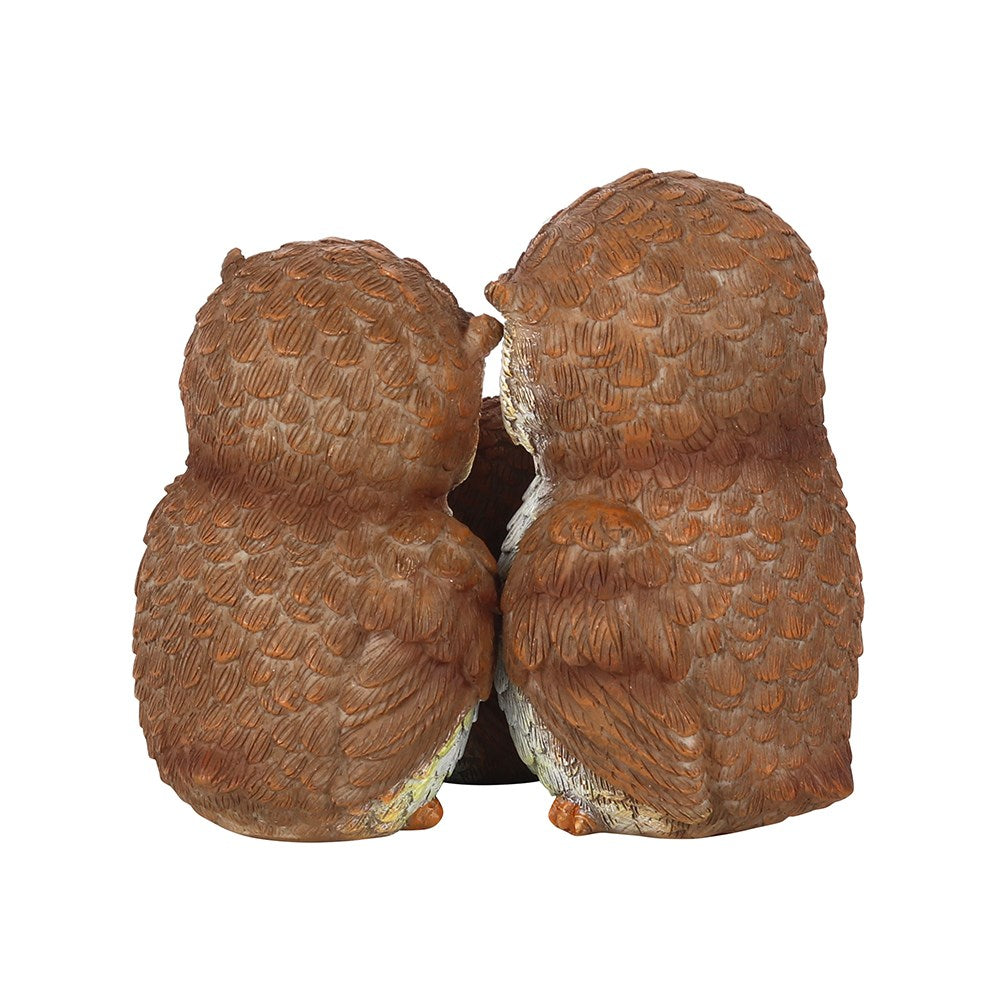 Owl family ornament featuring two parent owls and baby owl embracing in a sentimental family figurine