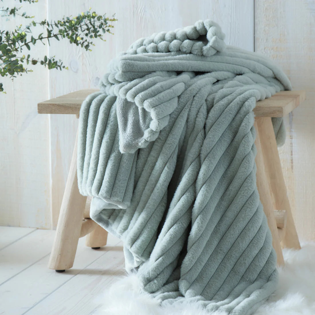 Appletree Morritz ribbed throw in green with soft luxury texture and cosy home styling