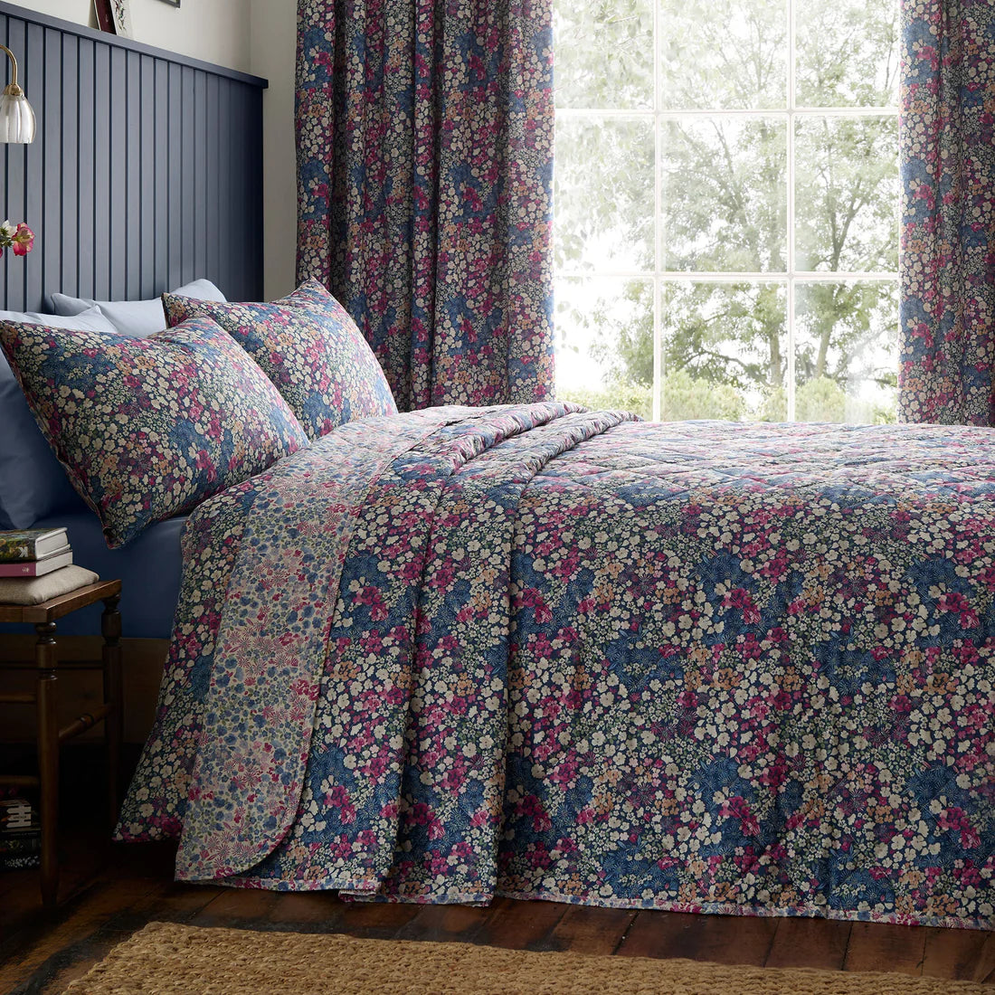 Dreams & Drapes Bessie quilted bedspread in navy with reversible floral design