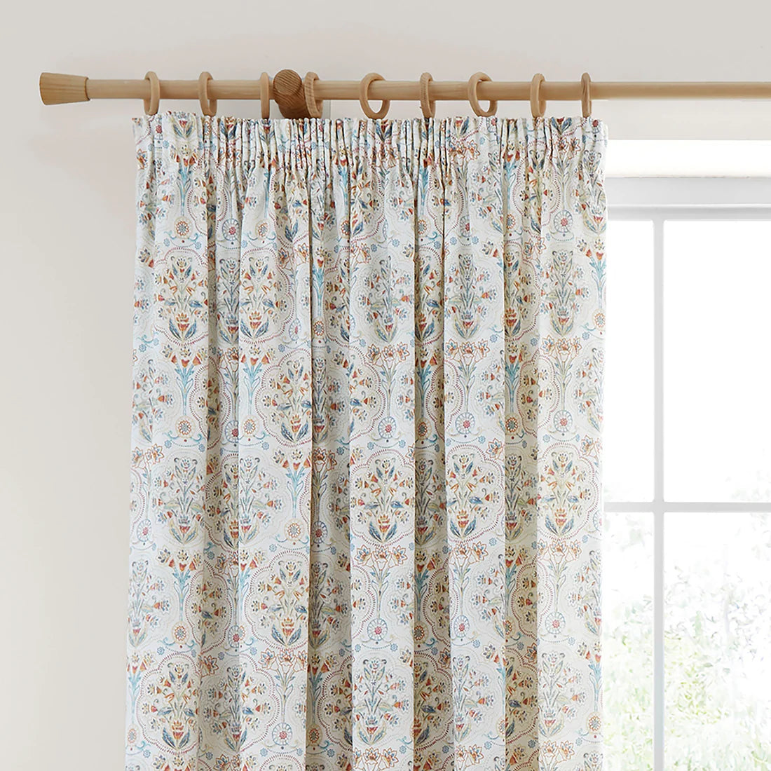 Dreams & Drapes Edena pencil pleat curtains in natural featuring elegant floral detailing in teal, gold and coral tones