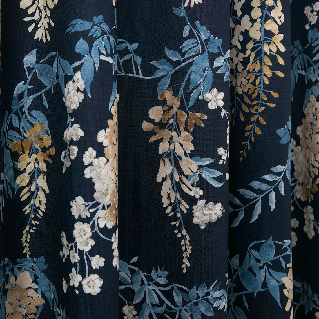 Dreams and Drapes Wisteria eyelet curtains in navy with elegant cascading floral design