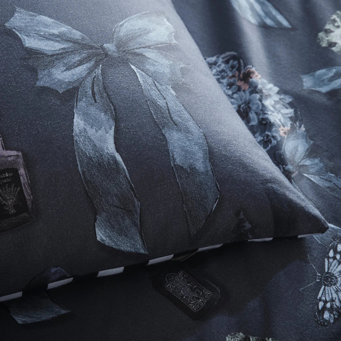Fusion Bows Noir gothic bow duvet cover set with floral details and reversible striped grey bedding