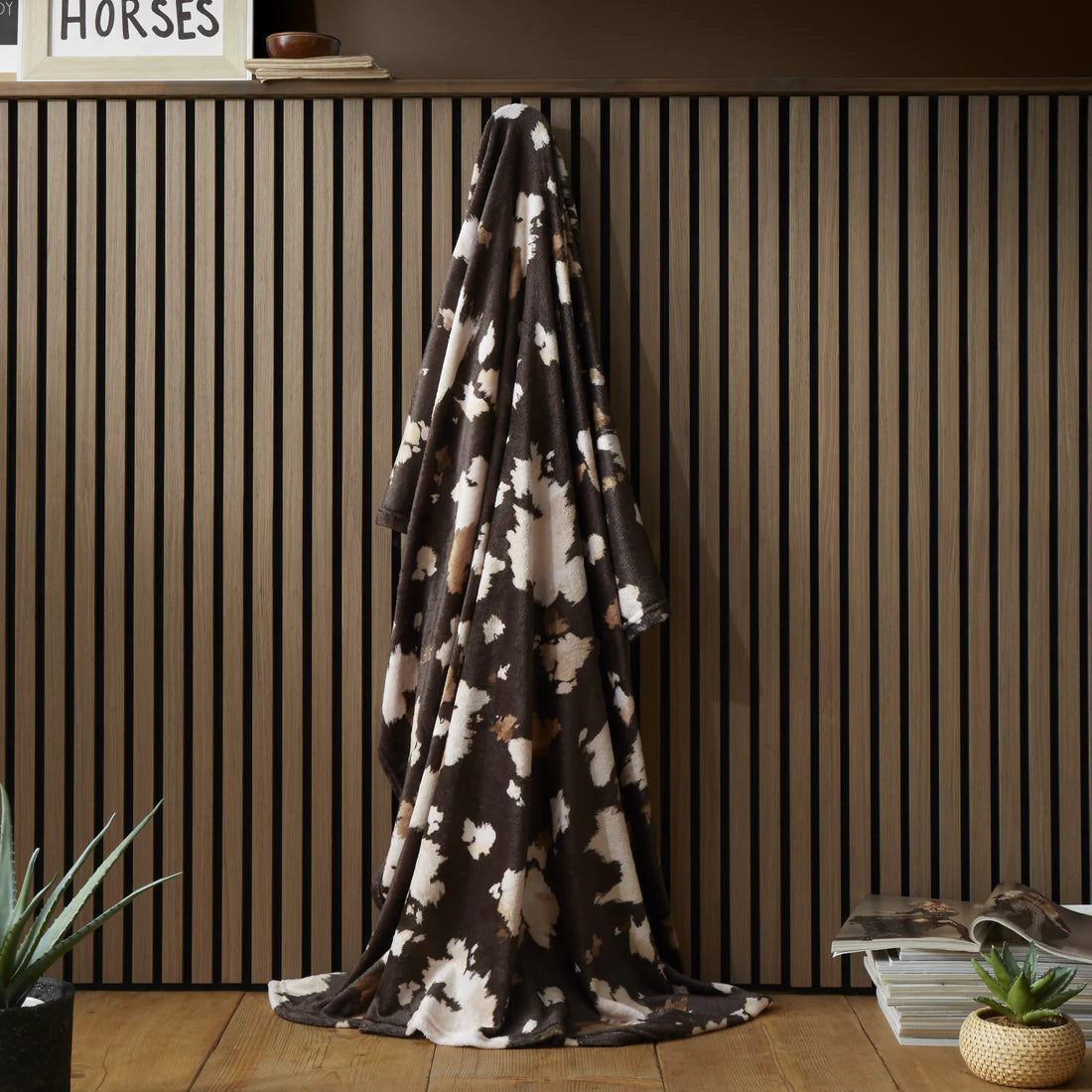 Fusion Cow Print fleece throw in chocolate with soft cowhide-inspired countryside design