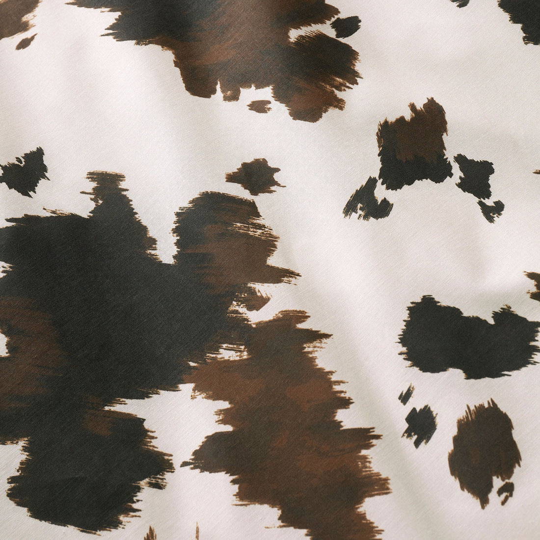 Fusion Cow Print duvet cover set with reversible cowhide pattern bedding in natural tones