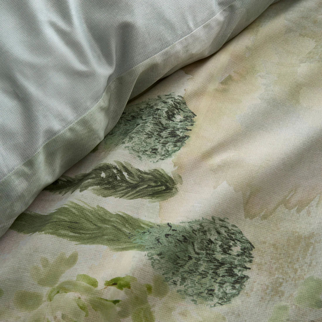 Soiree Hidden Garden duvet cover set in green with layered botanical foliage design and 200 thread count cotton