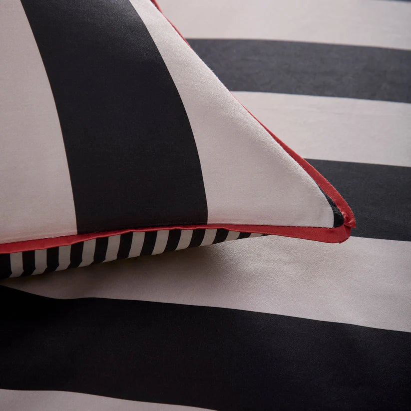 Laurence Llewelyn-Bowen Festivo Circus Stripe duvet cover set with black striped cotton sateen bedding