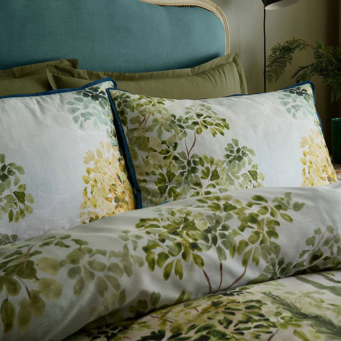 Soiree Hidden Garden duvet cover set in green with layered botanical foliage design and 200 thread count cotton