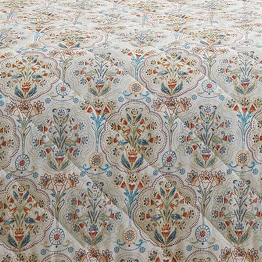 Dreams & Drapes Edena quilted bedspread in natural featuring elegant floral detailing in teal, gold and coral tones