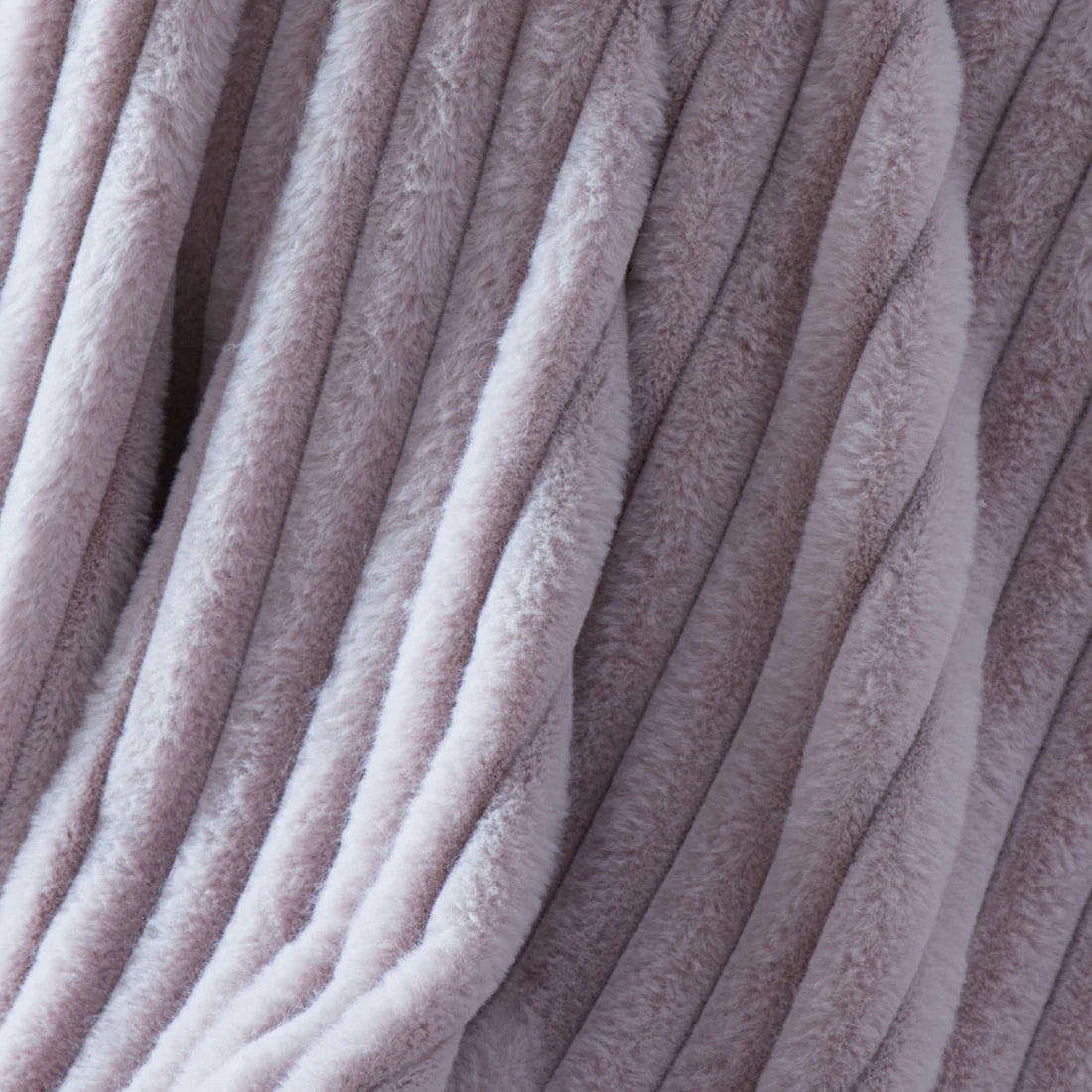 Appletree Morritz faux fur throw in mauve with luxurious soft texture and elegant home styling