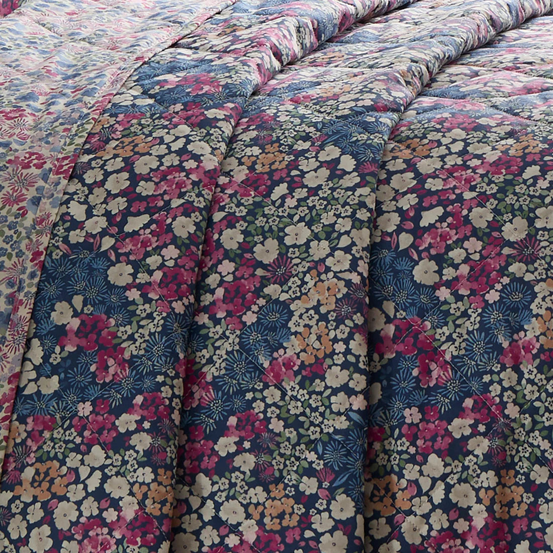 Dreams & Drapes Bessie quilted bedspread in navy with reversible floral design