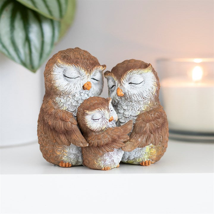 Owl family ornament featuring two parent owls and baby owl embracing in a sentimental family figurine
