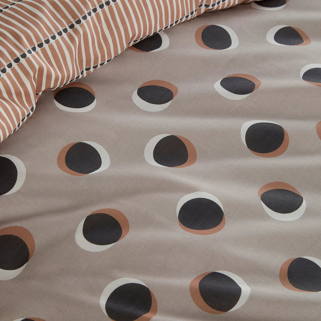 Fusion Polka Spot duvet cover set in natural with oversized retro polka dots and reversible stripe design