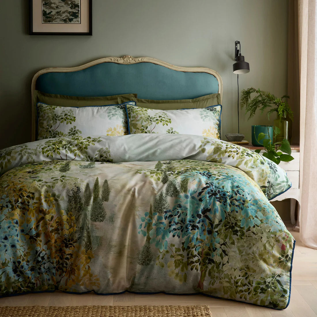 Soiree Hidden Garden duvet cover set in green with layered botanical foliage design and 200 thread count cotton