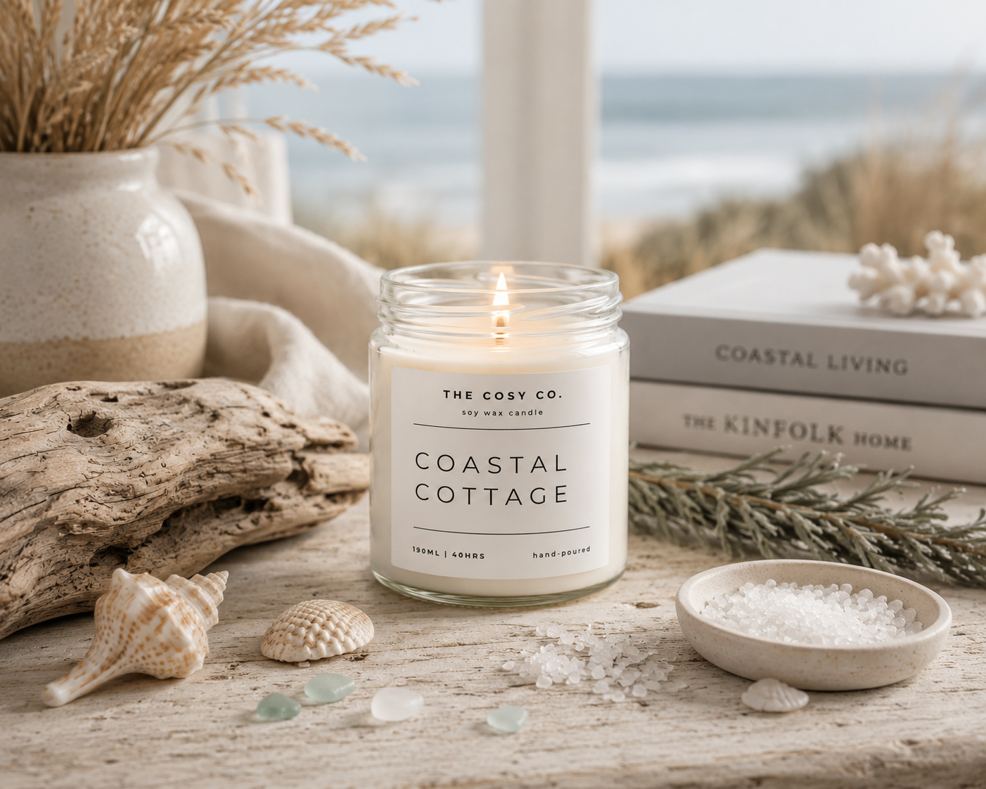 The Cosy Co Coastal Cottage soy candle in clear glass jar with fresh sea breeze and driftwood fragrance