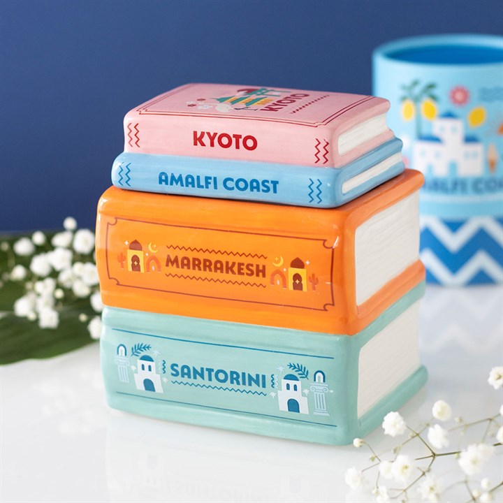Travel Book Stack ceramic oil burner and wax warmer inspired by colourful travel guide books
