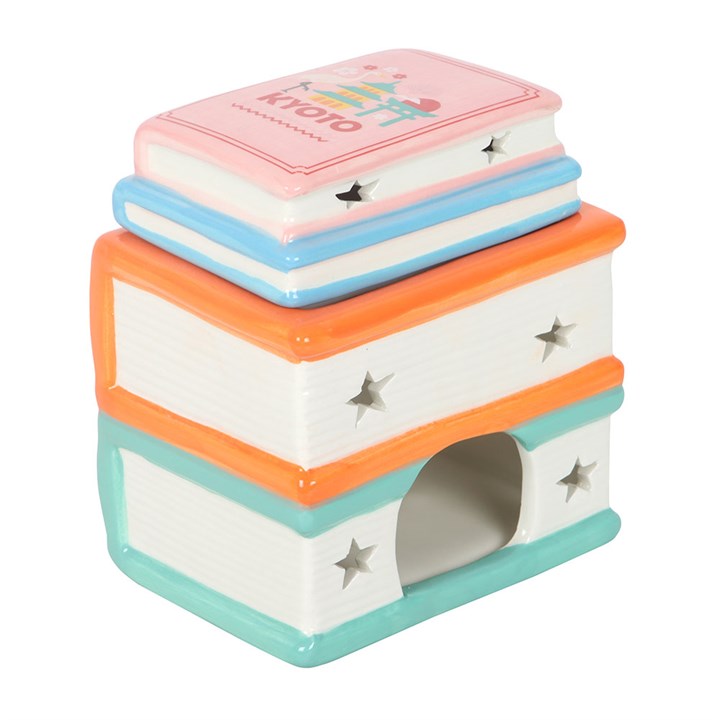 Travel Book Stack ceramic oil burner and wax warmer inspired by colourful travel guide books