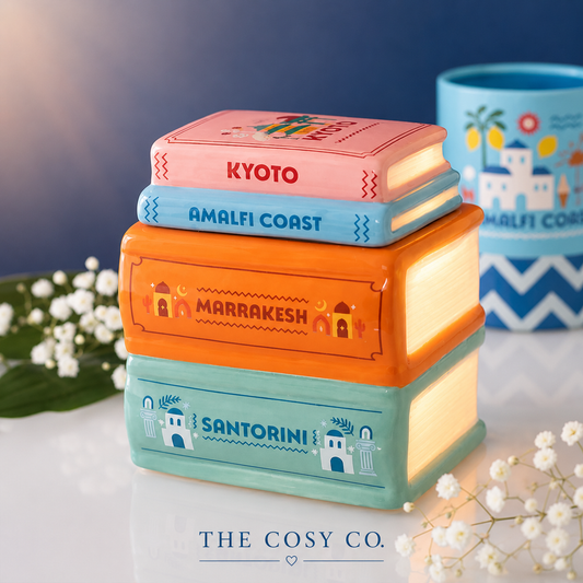 Travel Book Stack ceramic oil burner and wax warmer inspired by colourful travel guide books