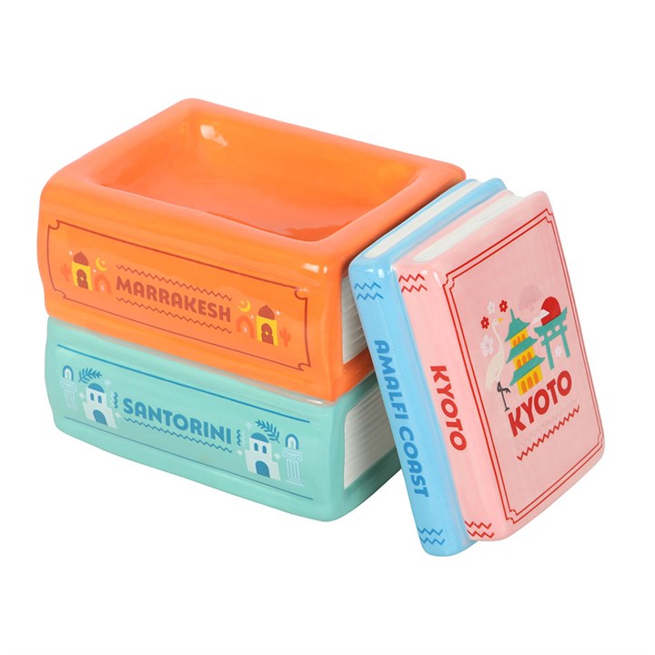 Travel Book Stack ceramic oil burner and wax warmer inspired by colourful travel guide books