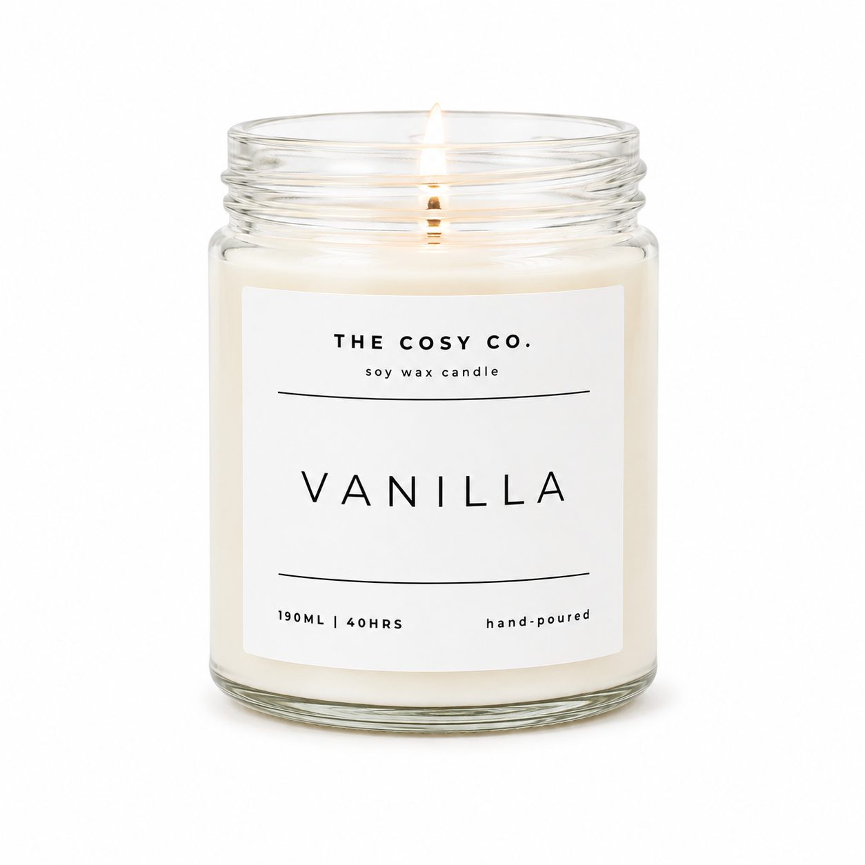 The Cosy Co Vanilla Comfort soy candle in clear glass jar with warm vanilla pod fragrance and floral notes